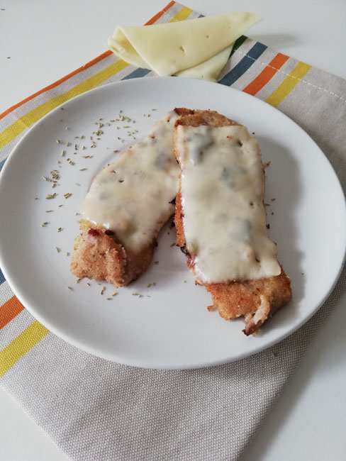 Arista di maiale croccante con copertura di Emmental